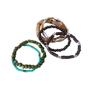 Set of bohemian vintage wooden bead and coconut shell bracelets with ethnic metal spacers