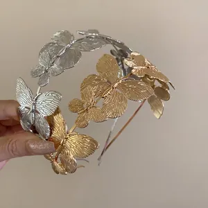 Elegant vintage French style metal butterfly headband in gold and silver finish.