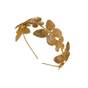Elegant French vintage gold metal butterfly headband with embossed butterfly details.