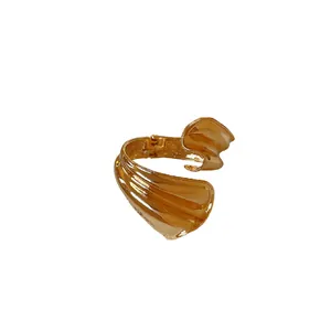 Fashion irregular twisted open metal bangle bracelet with polished gold finish for women