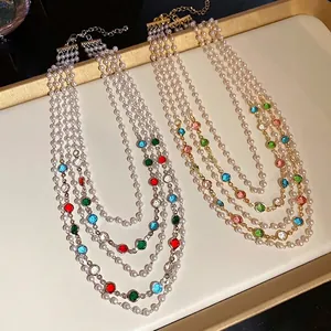 French vintage multilayer pearl necklace with colorful gemstones for an elegant look.