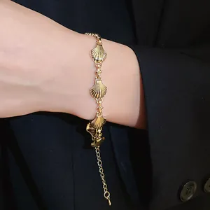 Vintage gold shell link bracelet with retro palace style details for women.