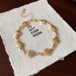 Close-up detail of a vintage gold-toned shell stripe link bracelet for women's jewelry