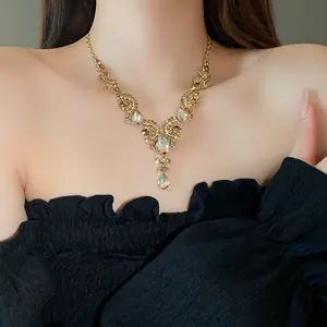 Detailed close-up of a vintage rhinestone necklace featuring an elegant water drop pendant