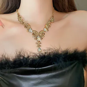 Detailed close-up view of a luxury vintage teardrop necklace with shimmering gold-tone rhinestones