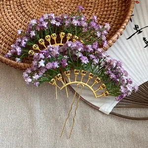 Close-up view of purple gypsophila flower hairpins on a woven straw basket background.