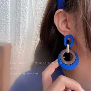 Vintage Klein blue geometric earrings featuring a chic double ring matte design
