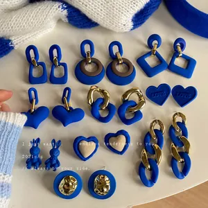 Elegant collection of Klein blue vintage style earrings with matte and gold accents