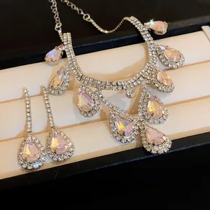 Detailed view of luxury water drop rhinestone necklace and earring set in jewelry box