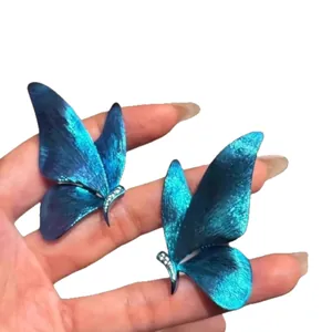 Elegant blue spray-painted butterfly stud earrings with sparkling rhinestone detail