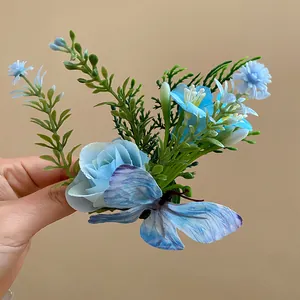 Detailed view of Mori style blue fabric flower hair clip with a delicate butterfly