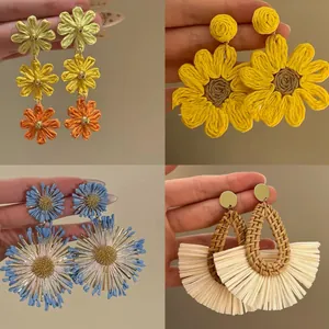 Detail view showing four unique styles of colorful woven flower and raffia earrings.