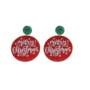 Red and green glittery round earrings featuring 'Merry Christmas' text and stars