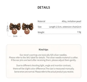 Detailed view of vintage gold bow earrings with imitation pearls and product parameters.