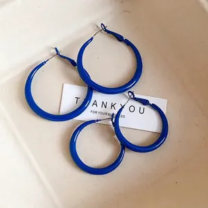 Oversized Klein blue chunky hoop earrings with silver pins for a bold vintage look