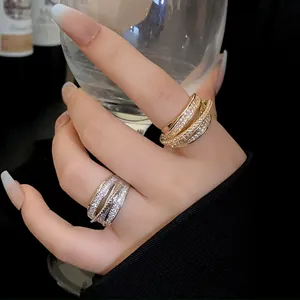 Detailed view of luxury multi-layer zircon open rings in gold and silver finish