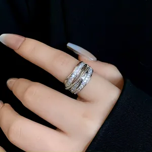 Close-up of multi-layer silver zircon open ring with sparkling geometric design