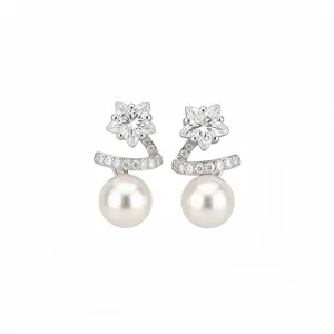 Elegant silver star and pearl stud earrings with sparkling cubic zirconia for women.
