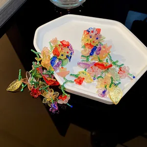 Close-up of colorful handcrafted floral beaded tassel earrings in vintage style