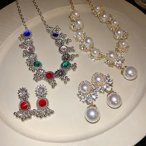 Detailed view of elegant vintage palace style jewelry sets with pearls and rhinestones
