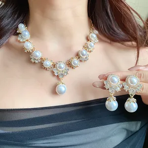 Elegant vintage court style necklace and earrings set with pearls and rhinestones.