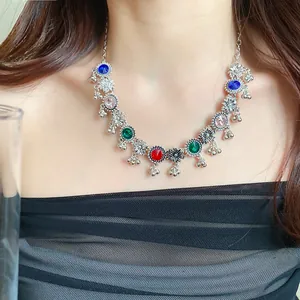 Detailed shot of retro court style necklace with colorful rhinestones and flower charms