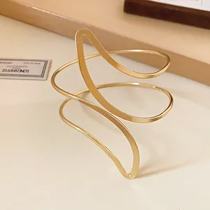 Detailed view of minimalist gold-finish leaf-shaped open cuff bracelet for women