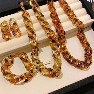 Chunky leopard print acrylic and gold chain necklace and bracelet jewelry set