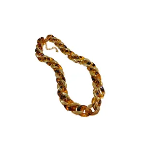 Chunky tortoiseshell and gold-tone acrylic chain necklace for a bold fashion statement