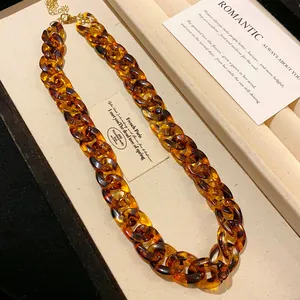 Close-up detail of a vintage amber tortoise shell acrylic chunky chain necklace