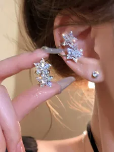 Macro shot of a sparkling zircon star ear cuff showing elegant craftsmanship