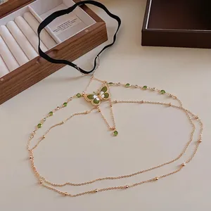 Elegant gold butterfly thigh chain jewelry with green zircon and black elastic band accessory