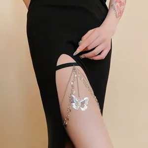 Close-up of elegant silver butterfly thigh chain featuring sparkling zircons and pearls