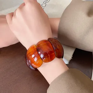 Retro chunky marbled amber resin elastic bangle bracelet with a wide oval design for women