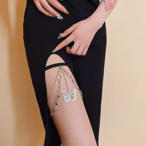 Detailed view of an elegant butterfly thigh chain with zircon accents on a model