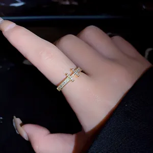 Close-up of gold-plated zircon letter ring showing fine craftsmanship and luxury texture