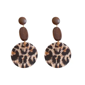 Bohemian minimalist wooden round drop earrings featuring a trendy leopard print pattern
