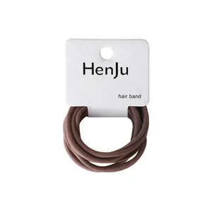 Minimalist high elasticity brown hair bands set on a white display card for daily use