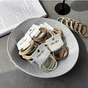 High-quality minimalist elastic hair bands in assorted earth tones on display cards