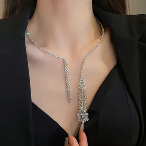 Macro view of elegant zircon tassel necklace with sparkling rhinestones on silver chain.
