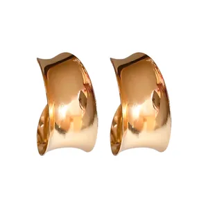 Elegant minimalist wide-surface curved gold metal stud earrings for modern women