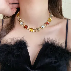 Close-up of a vintage-style multi-color square gemstone choker necklace on a model