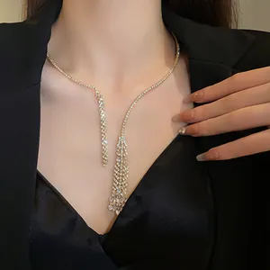 Elegant close-up of a sparkling zircon tassel necklace worn on a model's neck.
