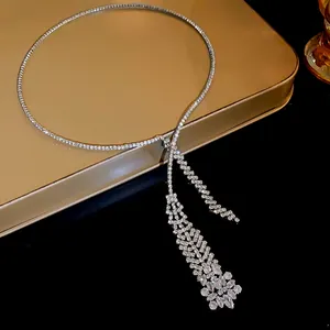 Macro view of elegant rhinestone zircon tassel necklace featuring a floral cluster detail