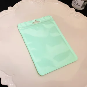 Detailed view of mint green resealable storage bag on a white decorative plate