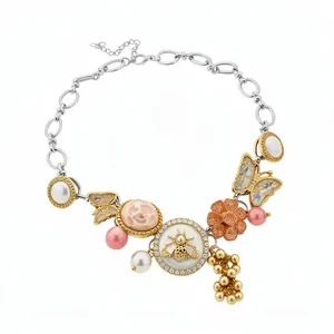 Statement necklace with crystal bee butterfly charms and pearls in gold silver finish