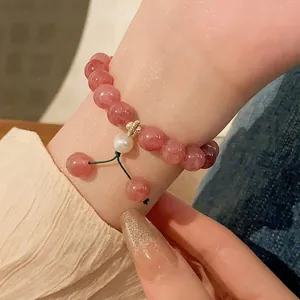 Handmade strawberry quartz beaded bracelet with pearl charm for women, elegant pink stretch jewelry