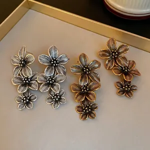 Elegant vintage floral tassel earrings with silver needles in gold and silver finishes