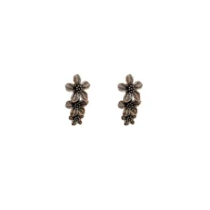 Vintage oxidized silver stud earrings featuring a triple stacked flower design