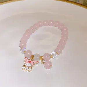 Handmade pink beaded bracelet with Sanrio My Melody rabbit charm and strawberry quartz beads.